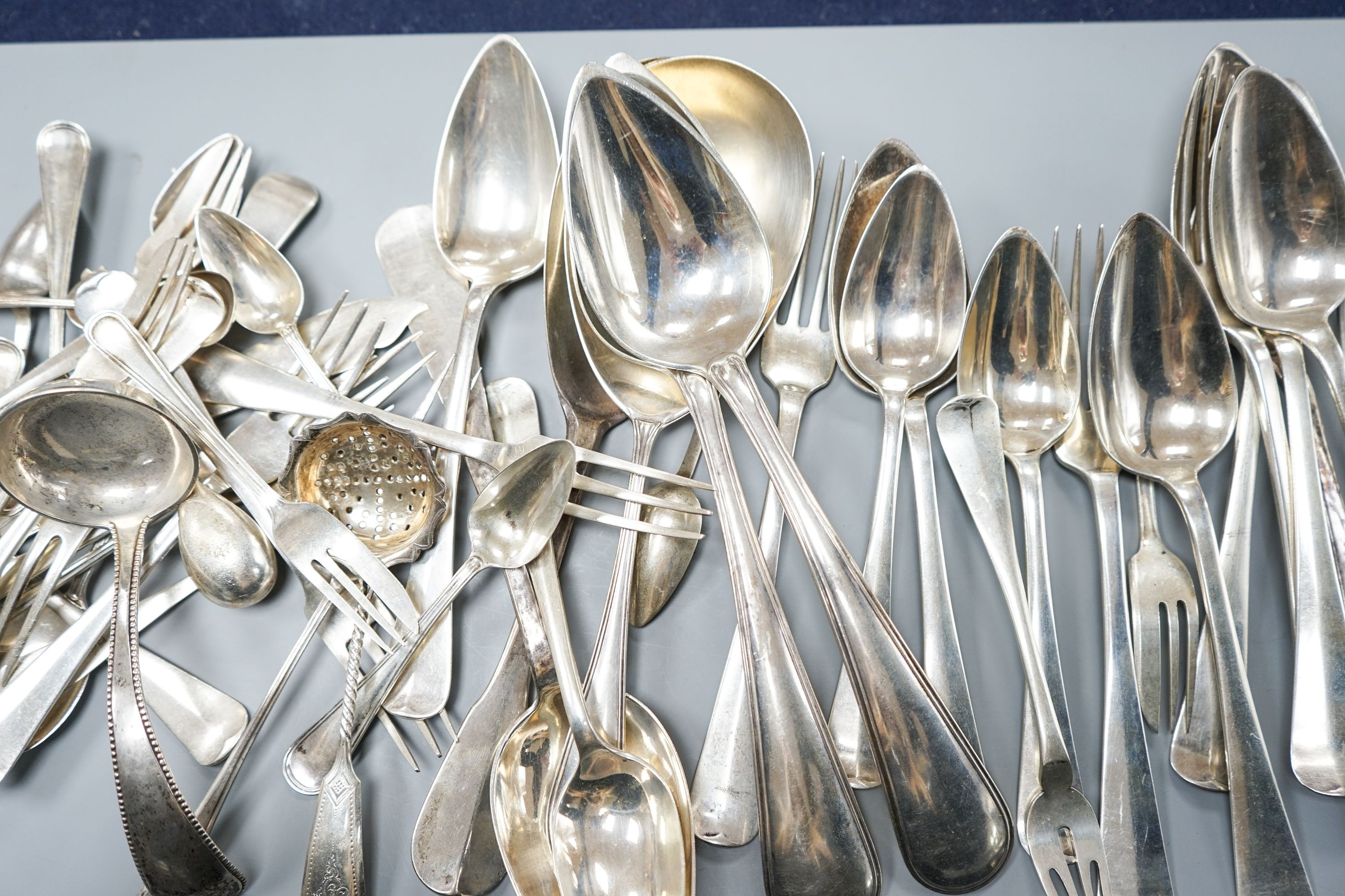 A quantity of assorted mainly Dutch white metal flatware including a part canteen, five English silver cake forks and two plated spoons